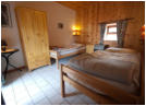 Schlafzimmer mit Einzelbetten im 4 Personen Cottage